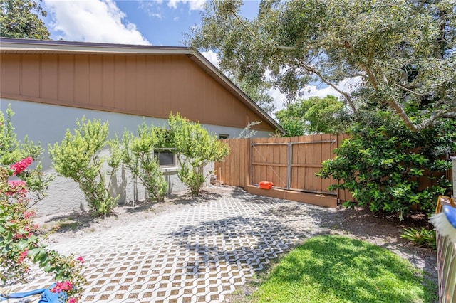 view of yard featuring a patio area and fence