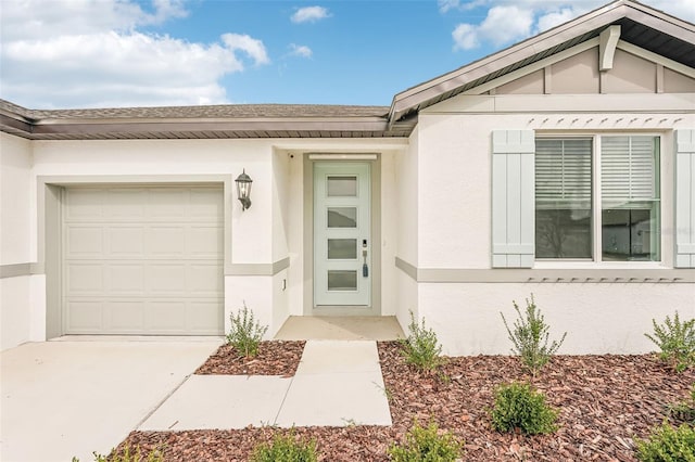 view of exterior entry featuring a garage