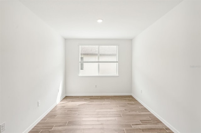 unfurnished room with light hardwood / wood-style flooring