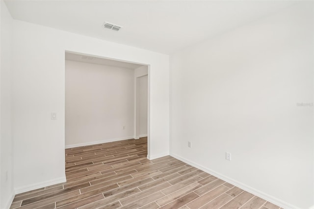 unfurnished room featuring light hardwood / wood-style flooring