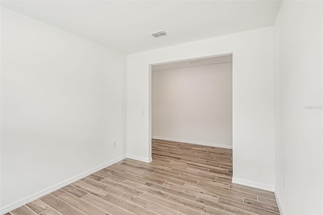 unfurnished room featuring light hardwood / wood-style flooring