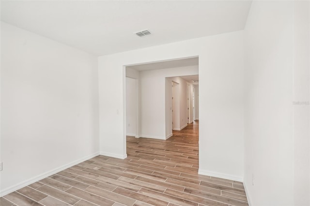 spare room with light hardwood / wood-style floors