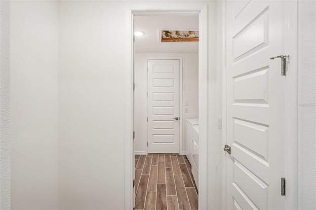 hallway featuring hardwood / wood-style floors