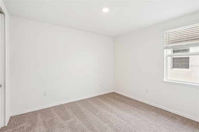 unfurnished room with carpet floors