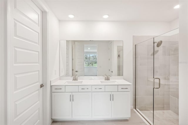 bathroom with vanity and walk in shower