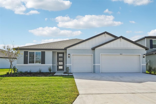 view of front facade featuring a front yard and a garage