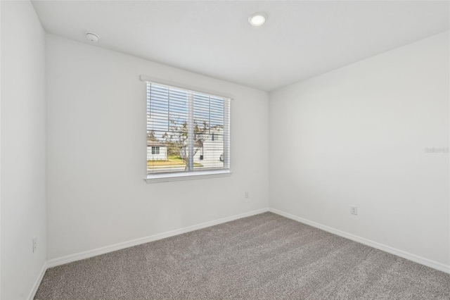 empty room featuring carpet floors