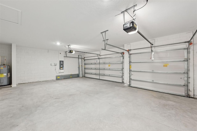 garage with a garage door opener, water heater, and electric panel