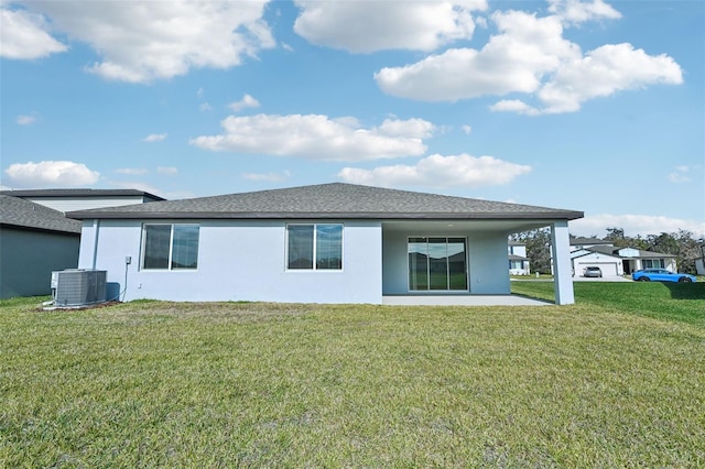 back of house with a patio, cooling unit, and a lawn