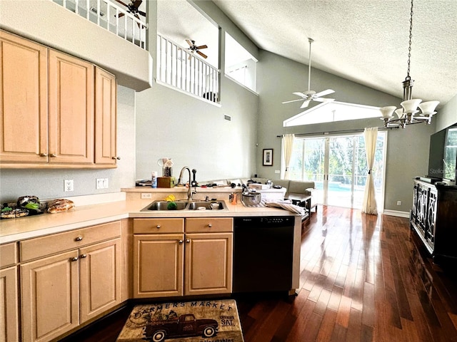 kitchen with a textured ceiling, dishwasher, light brown cabinetry, sink, and hanging light fixtures