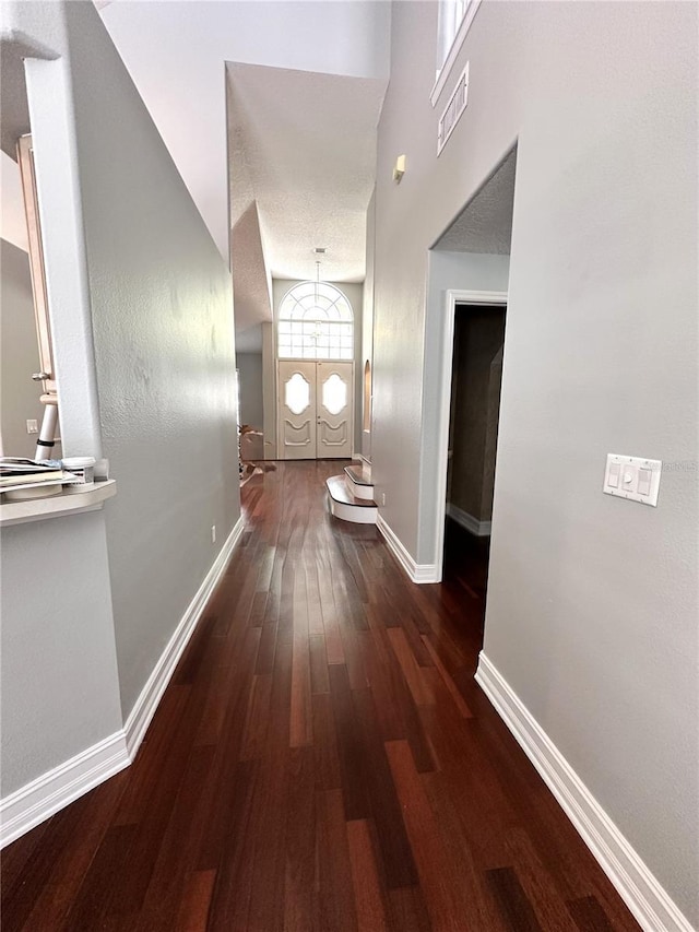 hall with dark wood-type flooring