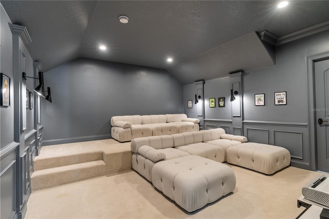 cinema with light carpet, a textured ceiling, and lofted ceiling