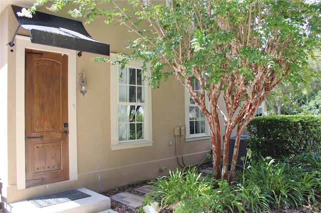 entrance to property featuring central AC