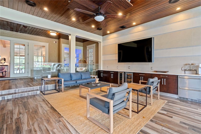 living room with wood ceiling, light hardwood / wood-style floors, ceiling fan, wine cooler, and french doors