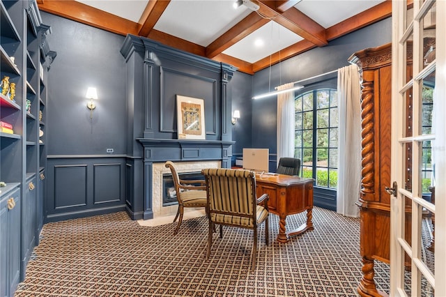 carpeted office space with beam ceiling and coffered ceiling