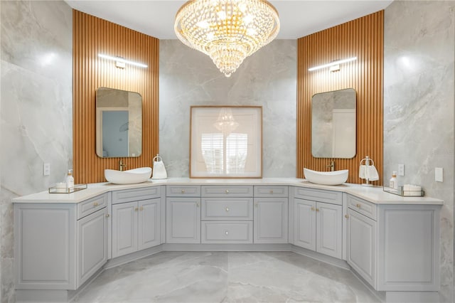 bathroom with a chandelier and vanity