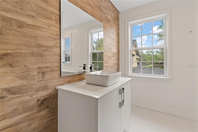 bathroom featuring vanity, tile patterned floors, and a wealth of natural light