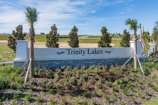 community / neighborhood sign featuring a rural view