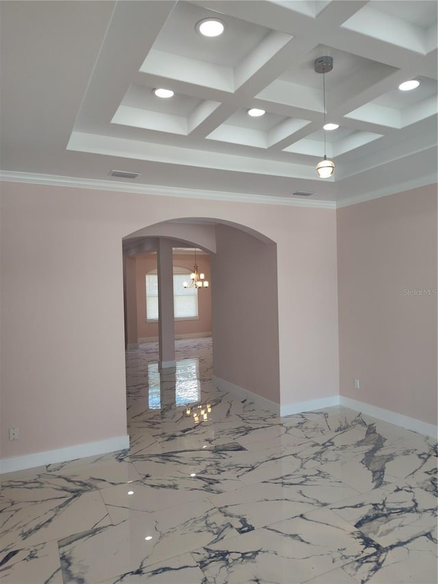 unfurnished room with ornamental molding and coffered ceiling