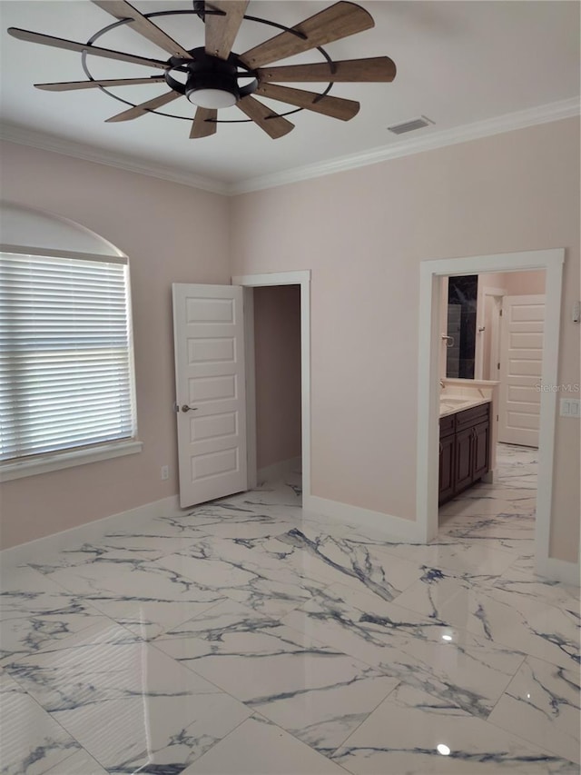 unfurnished bedroom with crown molding, ceiling fan, and ensuite bath