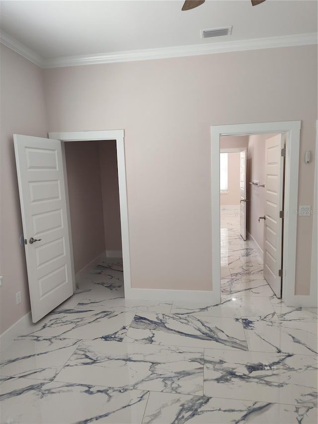 unfurnished room featuring crown molding and ceiling fan