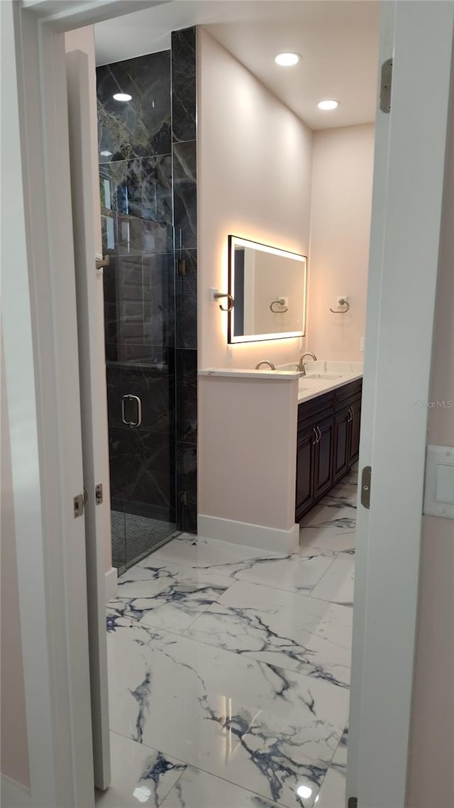 bathroom featuring vanity and an enclosed shower