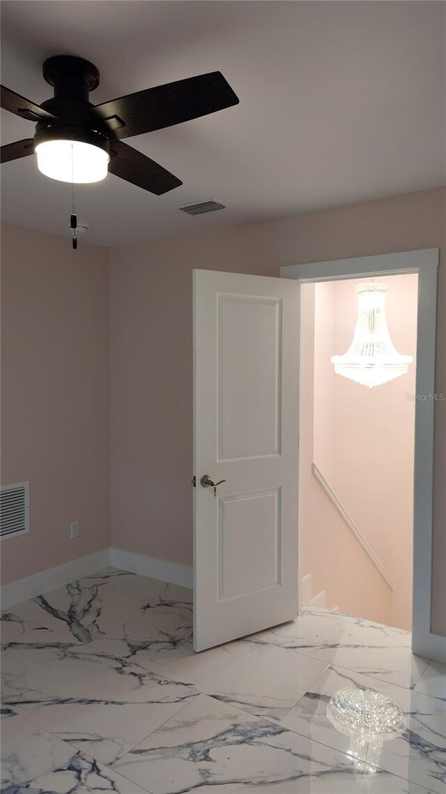 unfurnished room with ceiling fan