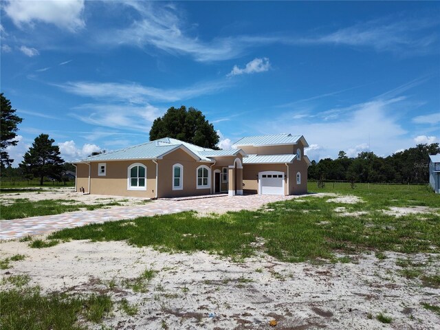 ranch-style home with a garage