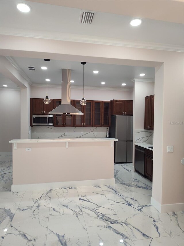 kitchen featuring island range hood, a center island, hanging light fixtures, appliances with stainless steel finishes, and decorative backsplash