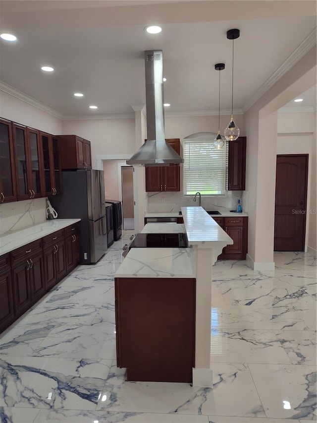 kitchen featuring a kitchen island, pendant lighting, island range hood, and backsplash