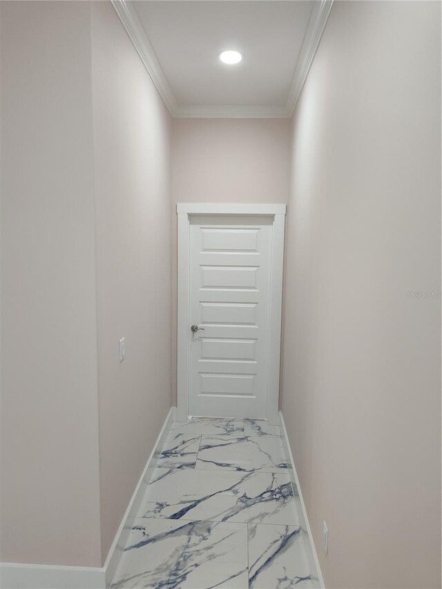 hallway featuring ornamental molding