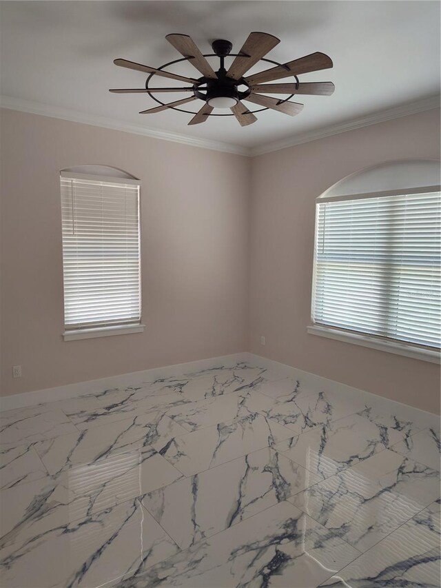 unfurnished room with ornamental molding, a wealth of natural light, and ceiling fan