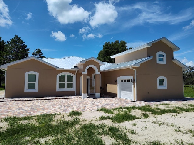 view of front of home with a garage