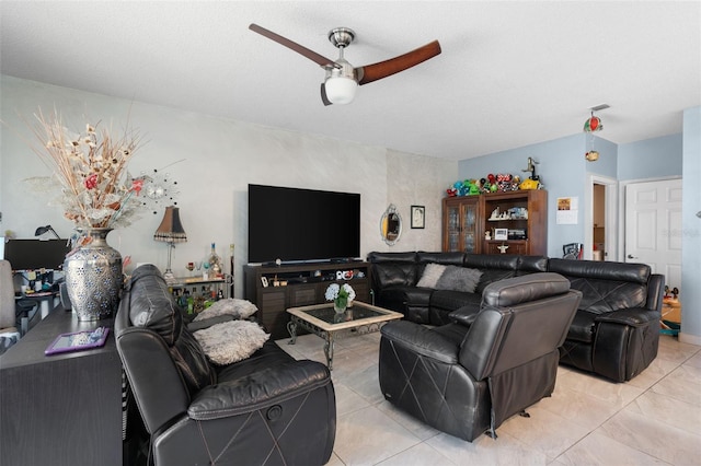 living room featuring light tile patterned floors, visible vents, and a ceiling fan