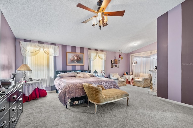 carpeted bedroom with baseboards, a textured ceiling, and vaulted ceiling