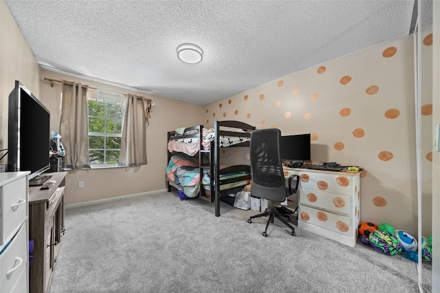 bedroom featuring wallpapered walls, carpet, baseboards, and a textured ceiling