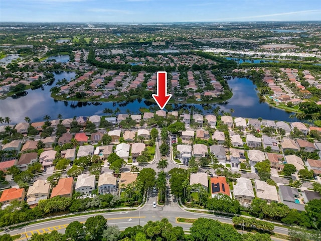 aerial view with a residential view and a water view