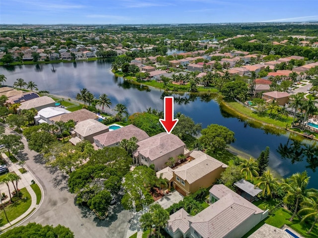 aerial view featuring a residential view and a water view