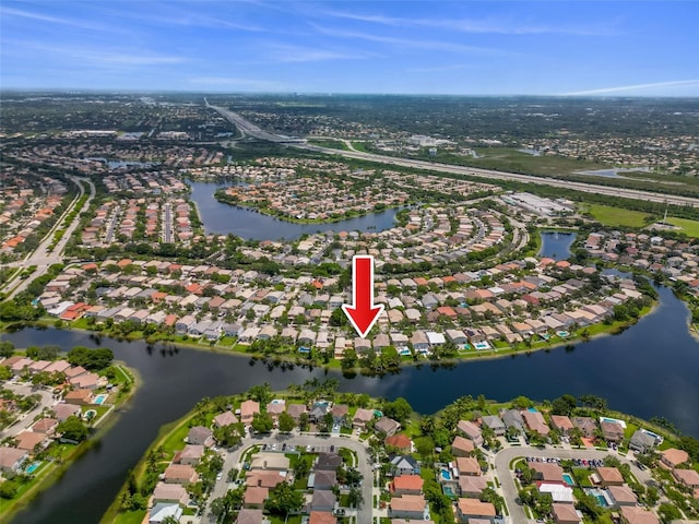 aerial view featuring a residential view and a water view