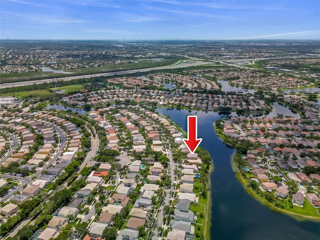 bird's eye view with a residential view and a water view