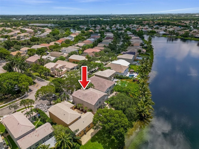 bird's eye view featuring a residential view and a water view