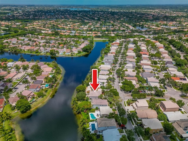 bird's eye view featuring a residential view and a water view