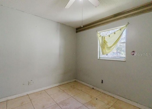 unfurnished room with ceiling fan