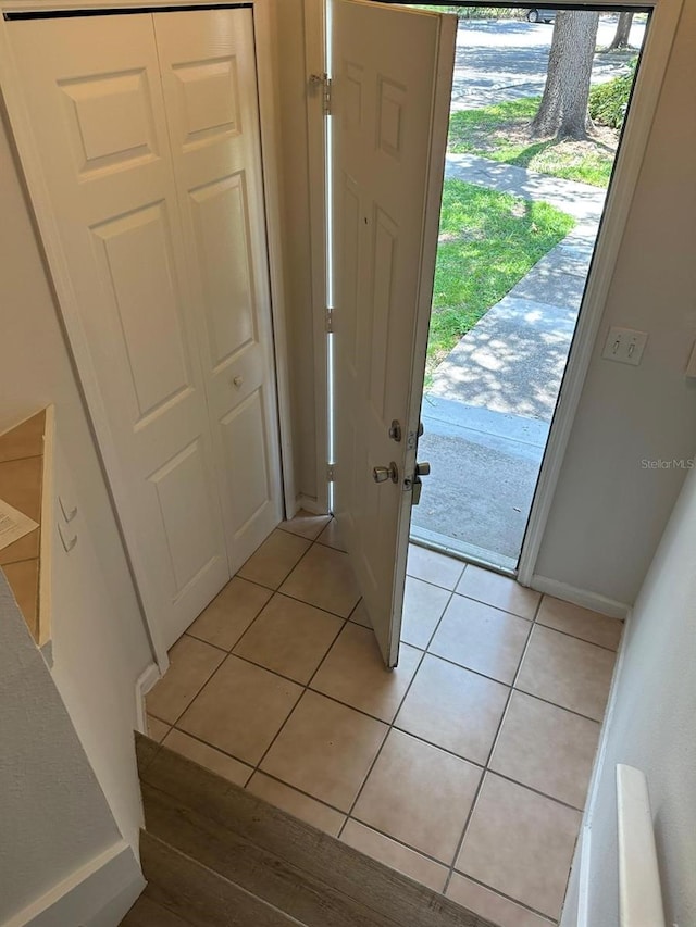 tiled foyer entrance featuring a healthy amount of sunlight