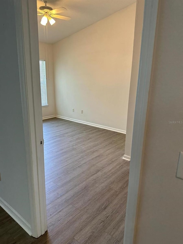 spare room with ceiling fan and hardwood / wood-style floors