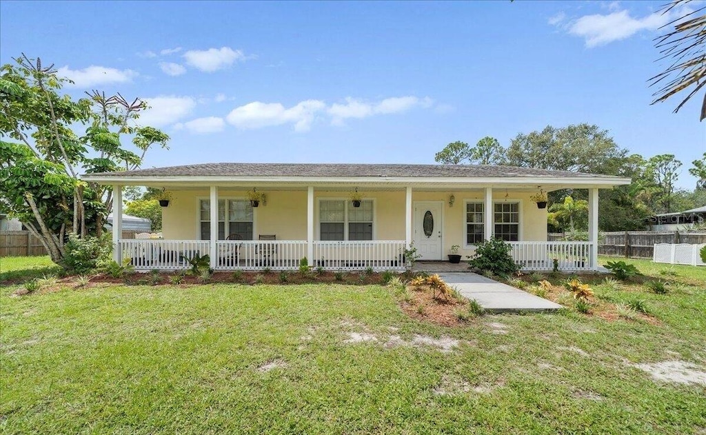 view of front of house with a front lawn and a porch