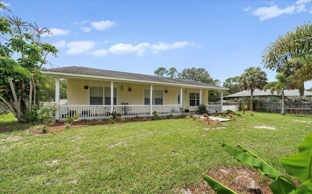 view of front facade with a front lawn and covered porch