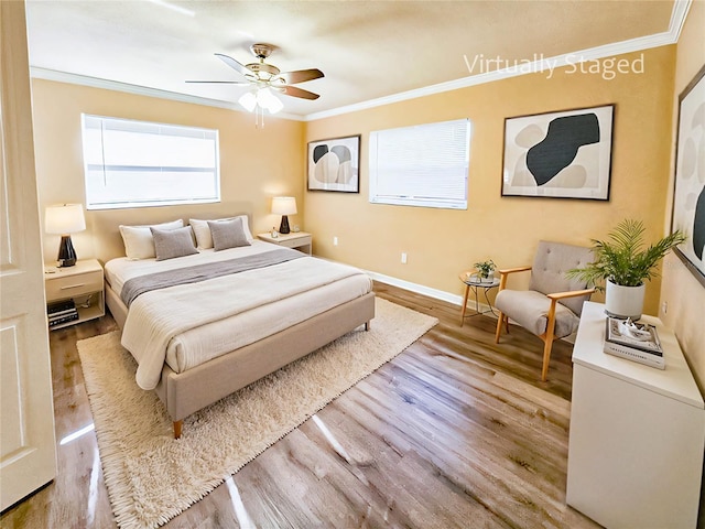 bedroom with light wood-type flooring, ceiling fan, and ornamental molding