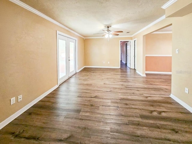 unfurnished room featuring hardwood / wood-style floors, a textured ceiling, french doors, ceiling fan, and crown molding