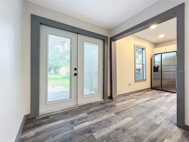 doorway to outside with french doors and hardwood / wood-style floors